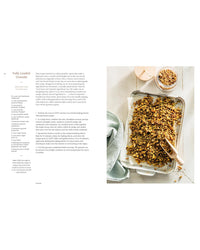 Granola on a baking tray with a recipe on the left side