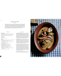 The book Spilled Natural Winemakers Stories & Recipes by Random House is open, showing a French veal stew recipe on one page and the dish served with natural wine on a brown plate atop a blue checkered tablecloth.