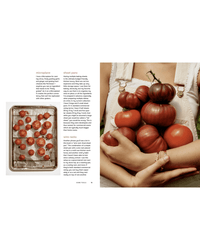A person in white overalls holds heirloom tomatoes beside a sheet pan of halved tomatoes; above kitchen tool descriptions, this scene offers dinner party inspiration from The Wishbone Kitchen Cookbook by Random House.