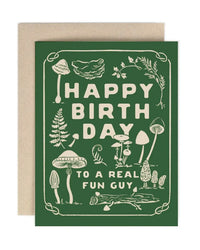 The Amy Heitman Fun Guy Birthday single card features whimsical mushrooms and plants on a green background with playful cream "Happy Birthday to a real fun guy" lettering. Includes coordinating envelope; blank inside for your message.