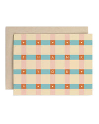 The Amy Heitman Thank You Check | Single Card features a beige, blue, and peach plaid design with white hearts and orange "THANK YOU" letters. Blank inside for your message. Includes a plain kraft envelope.