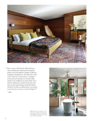 Ad At Home: Architectural Digest by Random House highlights a cozy bedroom with wood walls and a vibrant rug above a sleek bathroom with a white tub and light wood cabinets, all set amid lush greenery.