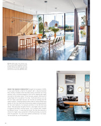 Discover Ad At Home: Architectural Digest by Random House, showcasing sunlit kitchens with large islands, wooden accents, water views, and stylish living spaces filled with artful décor and unique interiors.
