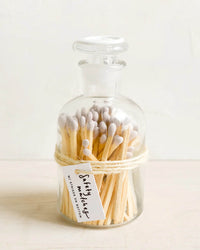 The LEIF Apothecary Jar Matches w/ Wax Seal in Lavender features a glass jar filled with matches, finished with a wax seal—ideal for storing matches or repurposing as a stylish container for small keepsakes.