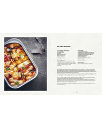 A dish of Mussels by Simon & Schuster rests on a gray surface next to a cookbook page displaying instructions and ingredient lists.