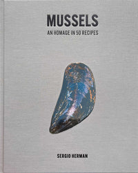 The cookbook Mussels by Simon & Schuster features a single mussel shell on a simple grey cover—ideal for those seeking creative ways to cook mussels.