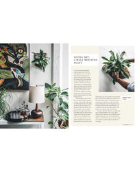 A magazine spread from Wild Creations by Simon & Schuster shows a stylish room with plants, lamp, and art on the left, while the right features an article on wall-mounted plants and DIY projects with an action photo.