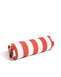 The Bolster Pillow - Crew Le Sirenuse Stripe by Business & Pleasure Co is a red and white striped indoor-outdoor pillow thats spill, stain, and fade resistant.