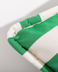 Close-up of the Euro Throw Pillow - Crew Canyon Green Stripe by Business & Pleasure Co, featuring bold green and white stripes, smooth fabric, and a padded edge—perfect as an outdoor accent against a simple background.
