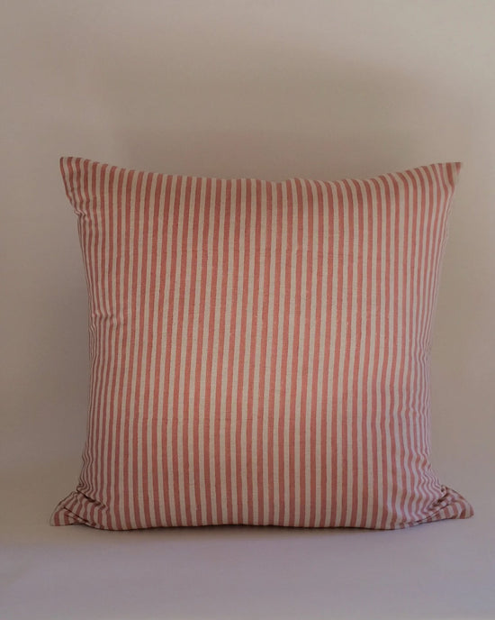 The Soil to Studio Babita Linen Pillow, 22 x 22 in Old Rose, features red and white vertical stripes and is shown against a plain light background.