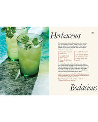 Two green cocktails sit on a textured surface, one garnished with cilantro. The scene highlights Chronicle Books' "Kindred Spirits," perfect for date night. On the right, a cocktail recipe is titled Herbaceous & Bodacious.