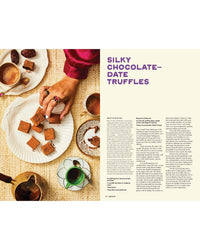 A hand reaches for chocolate-date truffles from Hot Date! by Chronicle Books, arranged on a white plate with coffee, tea, and dates—the perfect treat for fans of ancient superfoods or Middle Eastern recipes.