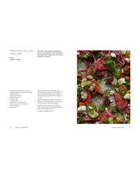 A Meal For Two by Chronicle Books features a watermelon, feta, and za’atar salad with olives, red onion, and herbs on the right and the recipe description on the left—ideal for easy weekday meals—all set against a white background.