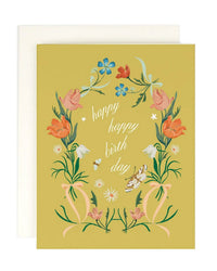 The Festival Birthday single card by Amy Heitman features yellow cardstock with pink and blue flowers, green leaves, a butterfly, white stars, and “Happy happy birth day” in white cursive. Blank inside; includes envelope.