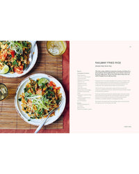 Two bowls of colorful fried rice with vegetables and lime sit on a bamboo mat beside a drink. On the right, "Thai Made Easy" by Chronicle Books presents a Railway Fried Rice recipe, featuring ingredients and Thai cooking instructions.