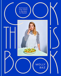 A woman in a striped shirt and white apron eats salad with Cook This Book by Random House, a foundational cookbook featuring essential techniques and repeat-worthy recipes, against a blue background with bold yellow title text.