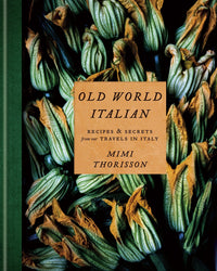 The cover of Old World Italian by Random House features a close-up of fresh zucchini blossoms with green stems and orange-yellow petals, highlighted by a tan title box in the center.