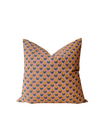 The Pakhi Linen Pillow by Soil to Studio is an 18 x 18 in handmade pillowcase crafted from vintage sari, featuring a peach background with blue and black floral patterns, displayed on a plain white backdrop.