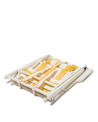 The Tommy Chair - Acacia White - Crew Mimosa Yellow Stripe by Business & Pleasure Co is a folded yellow and white backpack beach chair with pink straps and a UV-resistant canvas seat, shown on a white background.