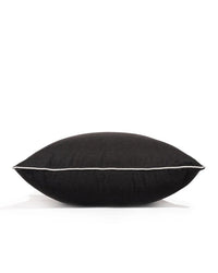 The Euro Throw Pillow - Rivie Black by Business & Pleasure Co is a black rectangular pillow with white piping, shown on a plain white background. Made with spill-resistant fabric, it's perfect for outdoor use, offering lasting style and durability.