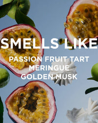 Halved passion fruits, limes, and meringue cookies rest on blue, alongside text: Perfume Oil in Matilda by Rosie Jane—notes of passion fruit tart, meringue, and golden musk create an irresistible scent.