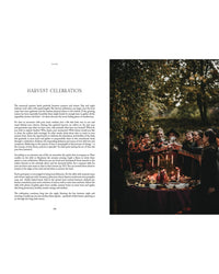 A group gathers outdoors at dusk around a candle-lit table, enjoying food and drink in a festive autumn atmosphere inspired by Nordic traditions—an enchanting scene from "Nordic Magic" by Cozy Publishing.