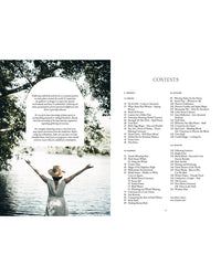 A woman in a wide-brimmed hat and white dress stands with arms raised by a lake, embraced by trees—a tranquil scene from "Nordic Magic" by Cozy Publishing. Beside her is a white Contents page with black chapter listings.
