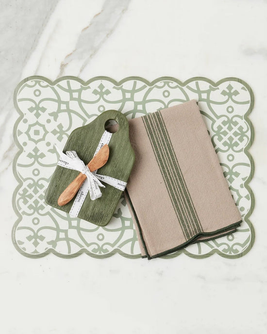 The Dutch Small Cheese Board w/ Spreader in Spruce Green by etúHOME is ideal for serving appetizers on your charcuterie board, featuring a stylish cutting board and spreader in a fresh green hue.