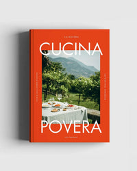 La Nostra Cucina Povera – Everyday Italian Eats by Cozy Publishing features a bright orange cover with an outdoor table set for a meal, wine glasses, and plates—evoking the essence of everyday Italian cooking amid lush greenery and mountains.