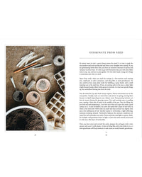 A flat lay featuring Living with Herbs by Cozy Publishing, seed pots, soil, gardening tools, and an open seed tray—everything you need to grow herbs and start your own home herb garden.