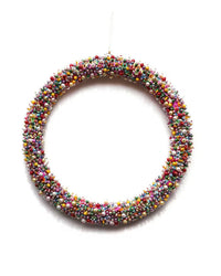 The Cody Foster Magpie Wreath - Large is a handcrafted holiday wreath featuring vibrant, multicolored round beads of varying sizes—an eye-catching piece for any festive setting.