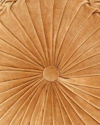 Close-up view of Casa Amarosa's Velvet Round Pillow in Clay, featuring a central button and radiating pleats that form a sunburst pattern in soft, clay-colored fabric—a stylish accent pillow for any space.