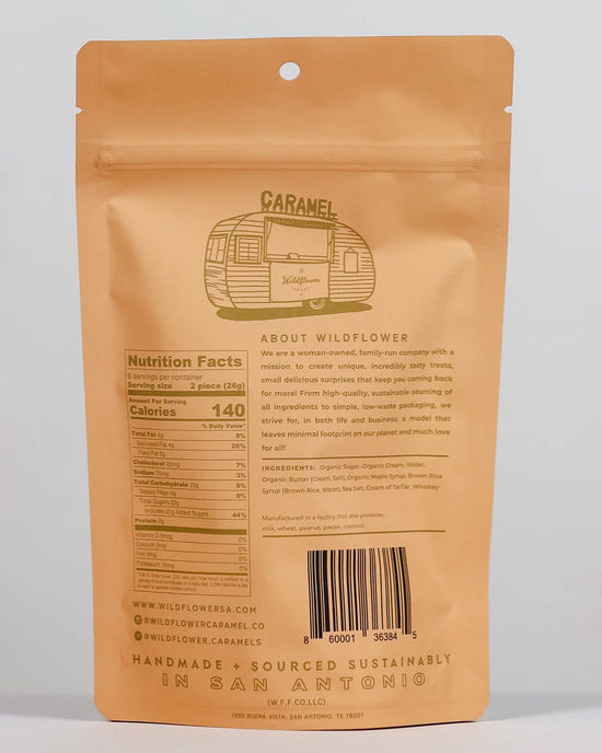 Tan resealable bag featuring a sketched camper and "Maple Whiskey Caramels" at the top. Wildflower Caramel Co—a Texas-based, women-owned company—features nutrition facts and sourcing info on the back.