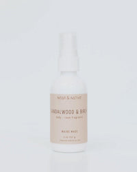 The Near & Native Room & Body Mist in Sandalwood & Birch, Maine Made in a 2 oz spray bottle, is shown on a light background—ideal as a travel-friendly fragrance for room and body with notes of sandalwood and birch.