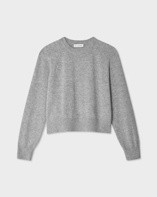 The White + Warren Cashmere Easy Sweatshirt in Grey Heather is a cropped crewneck with long sleeves and a classic shape, shown on a flat, light gray background.