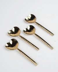 The Casa Amarosa Heart Shaped Brass Cocktail Spoons S/4 features four hammered brass spoons with heart-shaped heads, elegantly displayed on a white background.