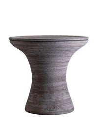 The Bergs Potter Celeste 15-inch Pedestal Planter in Raw Grey features a round, hourglass silhouette with a smooth finish and subtle lines, serving as a stylish planter or side table that complements modern décor.