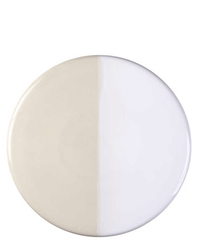 The Bergs Potter Nuna Glazed 11 inch Tray in Sandstone/Mineral White features a round ceramic design with a vertical beige and white split, seamlessly complementing any décor. Pairs perfectly with Nuna coasters for a stylish table setting.