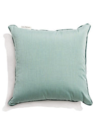 The Small Square Throw Pillow - Rivie Green by Business & Pleasure Co features black piping and is made from durable Pleasuretex® fabric for indoor or outdoor use, shown in a top-down photo on a white background.