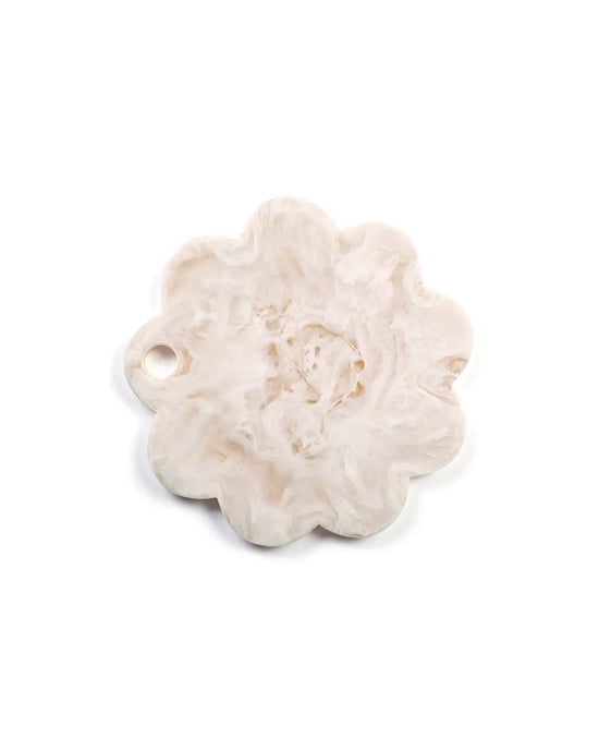 The 9in Scallop Resin Cheese/Charcuterie Board in Vanilla by Casa Amarosa features a white, flower-shaped design with a small hole near one edge, shown on a plain white background.