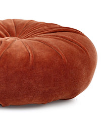 The Mini Velvet Round Pillow in Rust by Casa Amarosa features a petaled pleat design and stitched detailing, displayed on a white background.