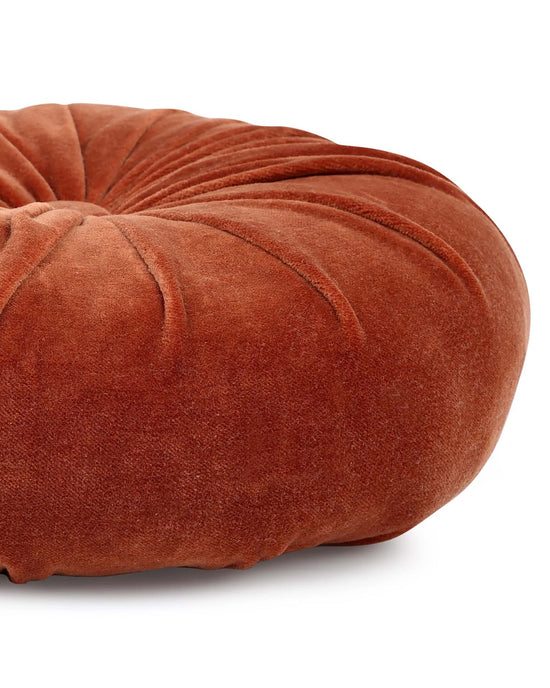 The Mini Velvet Round Pillow in Rust by Casa Amarosa features a petaled pleat design and stitched detailing, displayed on a white background.