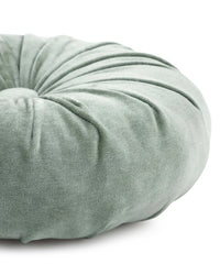 Close-up of the Casa Amarosa Mini Velvet Round Pillow in Sage Green, featuring hand-stitched details, gathered fabric design, and a central button—ideal as a decorative accent.
