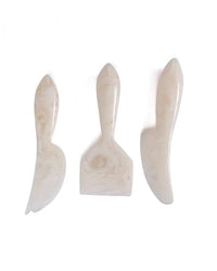 The Casa Amarosa Resin Cheese Knife Set of 3 in Vanilla features white, marbled resin handles and unique blades—an elegant set ideal for your charcuterie board.