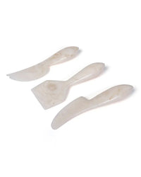 The Casa Amarosa Resin Cheese Knife Set of 3 in Vanilla features stylish, handmade knives with varied blade shapes, arranged side by side on a white background—perfect for elevating your charcuterie board.