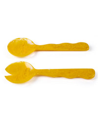The Casa Amarosa Resin Salad Server Set in Mustard, featuring a spoon and a fork, is displayed side by side on a white background.