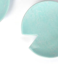 The Casa Amarosa Resin Salad Server Set in Sky Blue is handmade in India, featuring sleek pastel blue utensils with a unique triangular cut-out, displayed on a white background.