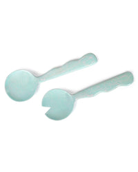 The Casa Amarosa Resin Salad Server Set in Sky Blue features two handmade servers with patterned handles—one solid spoon and one forked, crafted in India.