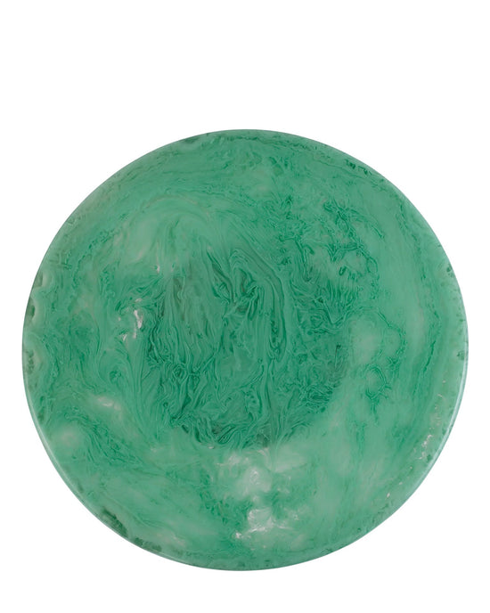 The Casa Amarosa Scallop Resin Cake Stand in Green features a round, shallow shape with a marbled green pattern and a smooth, glossy surface, seen from above.