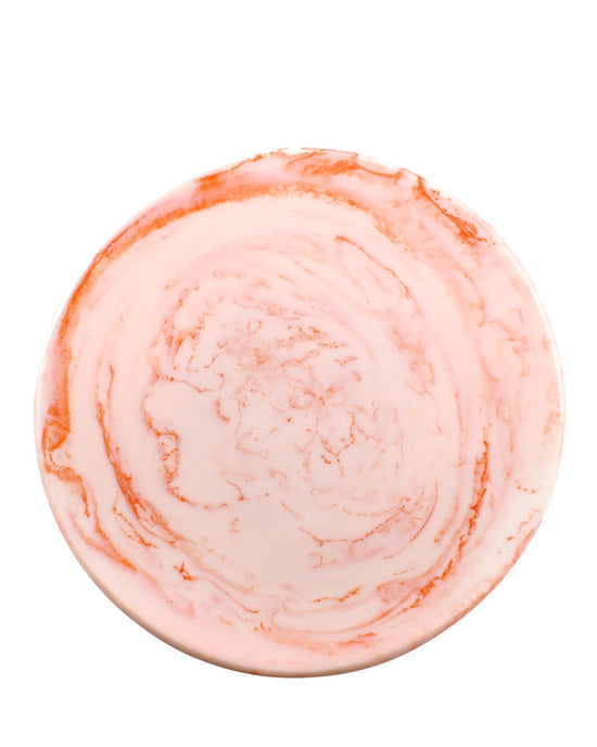 The Scallop Resin Cake Stand in Ivory Pink by Casa Amarosa, featuring a pink and white marbled design, is shown from above against a white background.